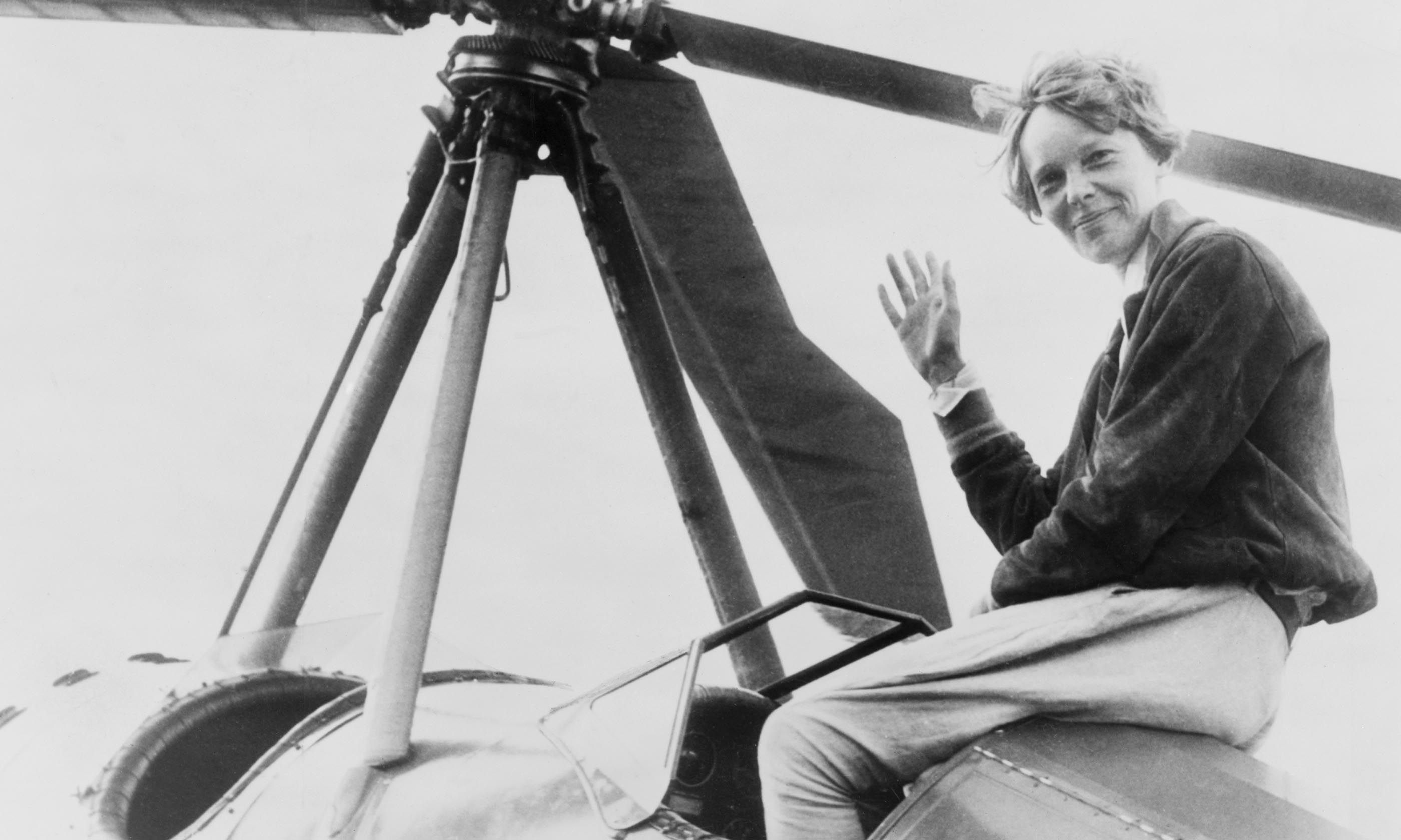 Amelia Earhart waving from her cockpit in 1932 after becoming the first woman to sail across the Atlantic solo (Dreamstime)
