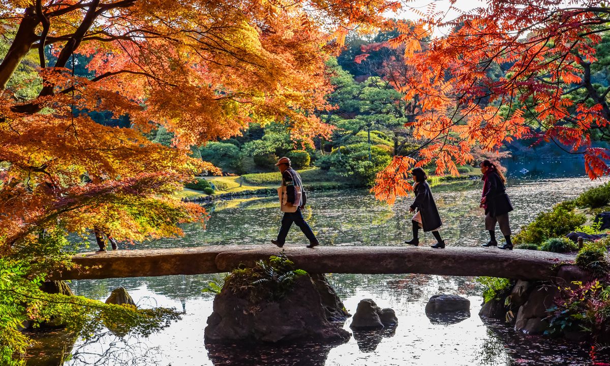 Crossing a stone bridge in Rikugien Garden (Shutterstock)