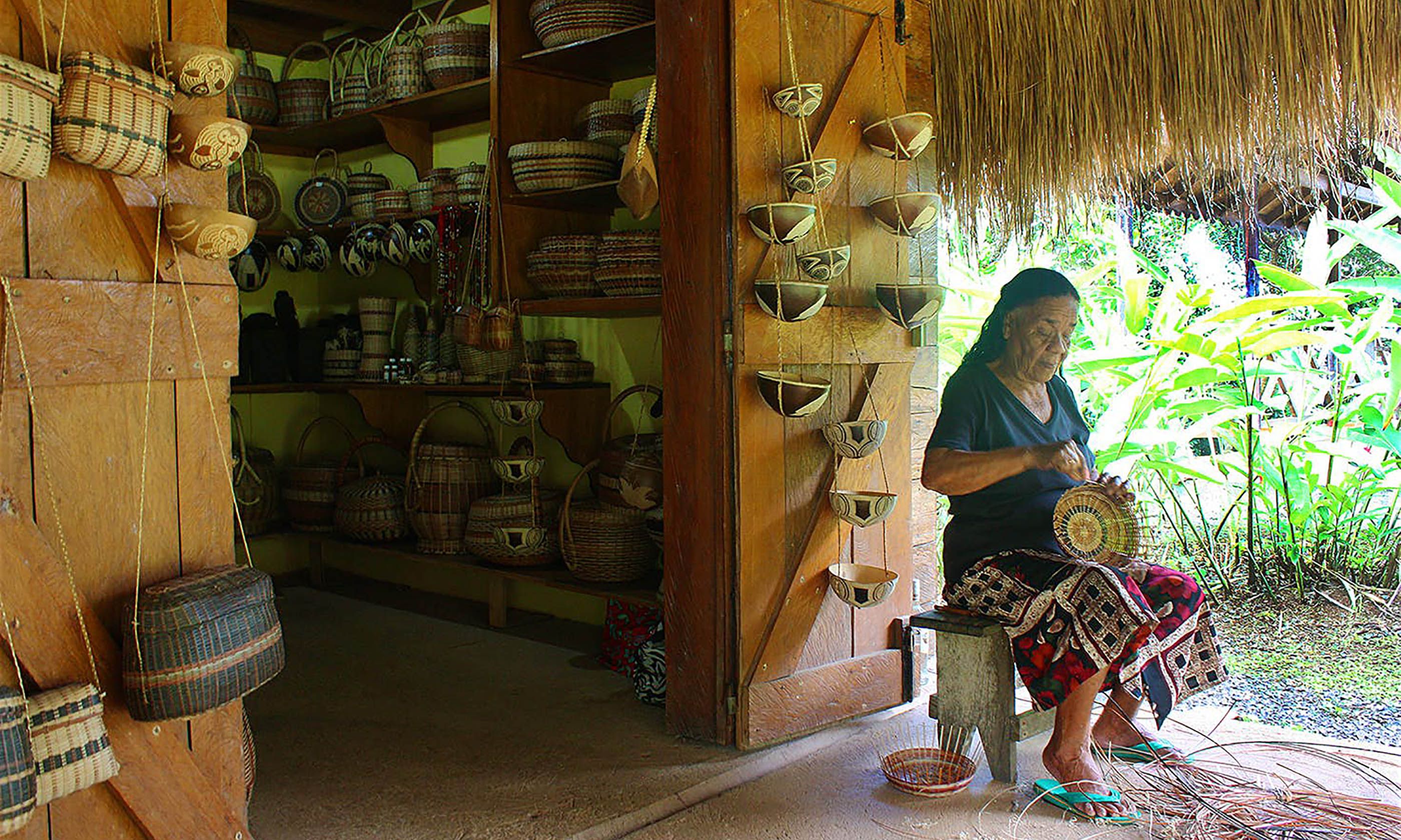 A woman making a traditional reed basket