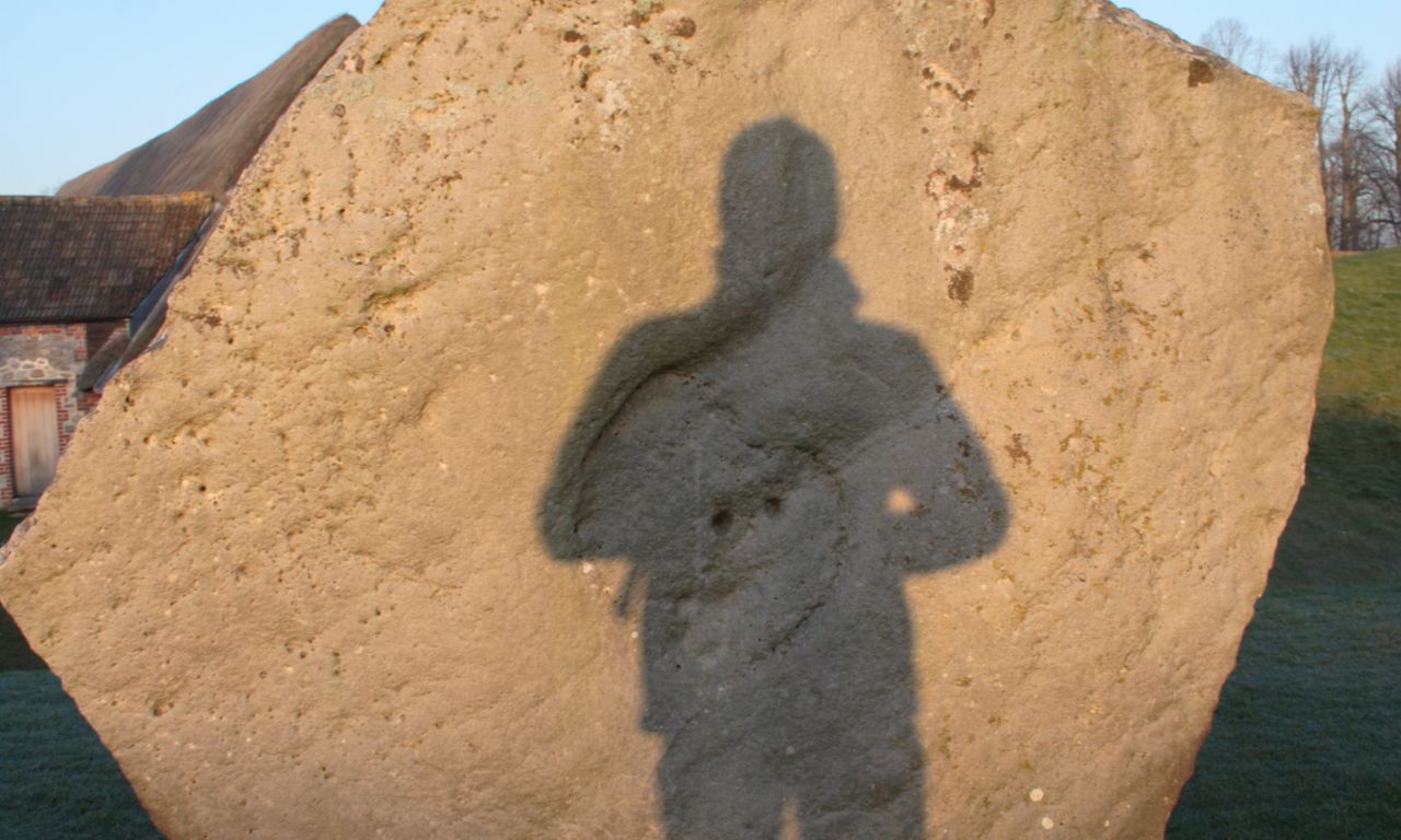 A mysterious shadow on an Avebury stone (Dreamstime)