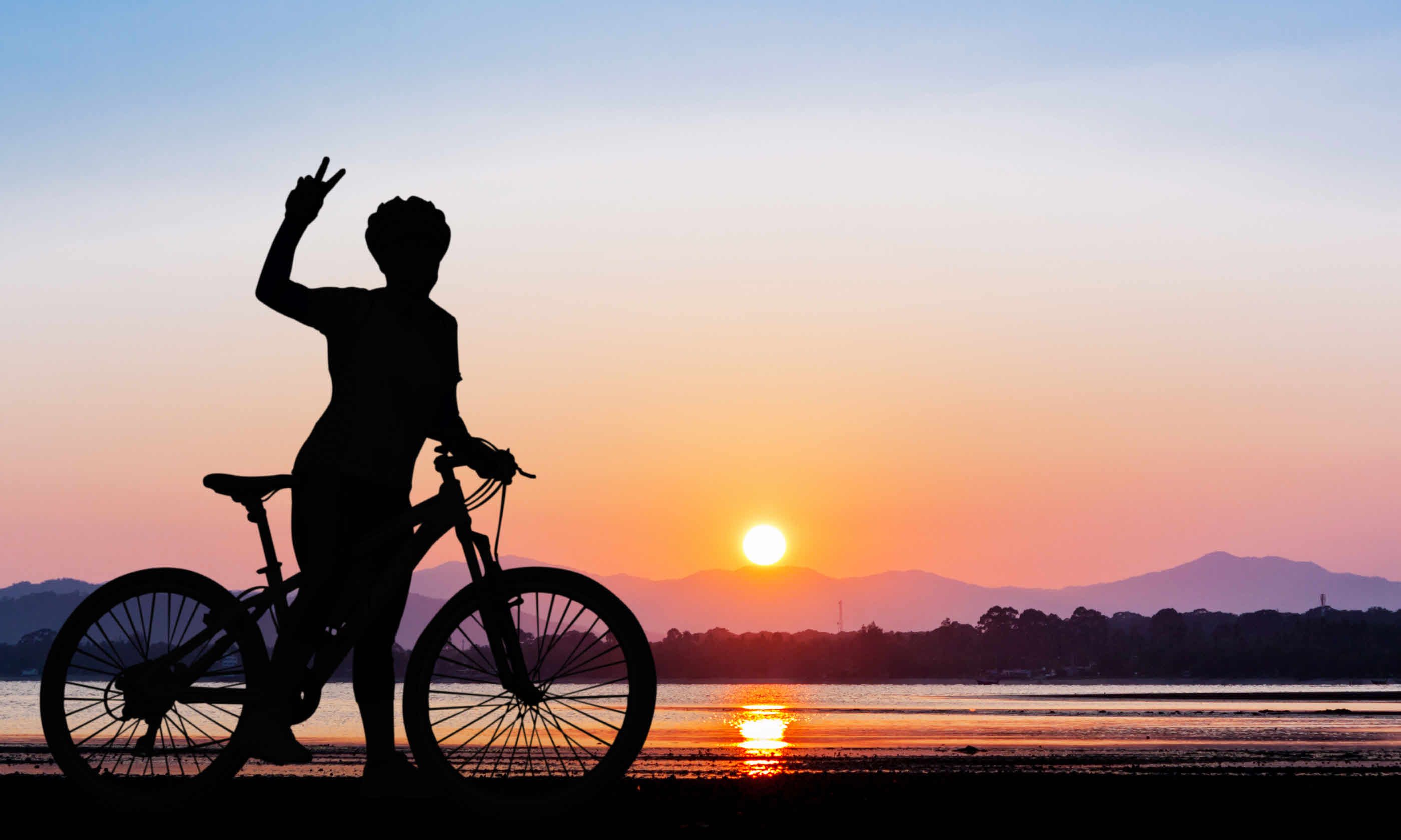 Cycling at sunset, Thailand (Shutterstock)