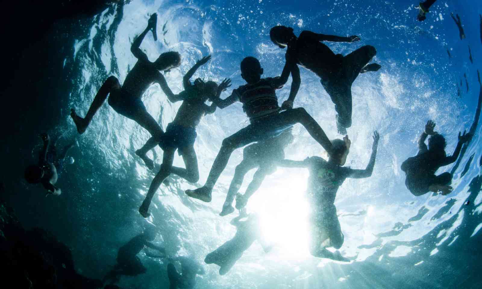 Children playing in the waters off the Solomon Islands (Shutterstock)