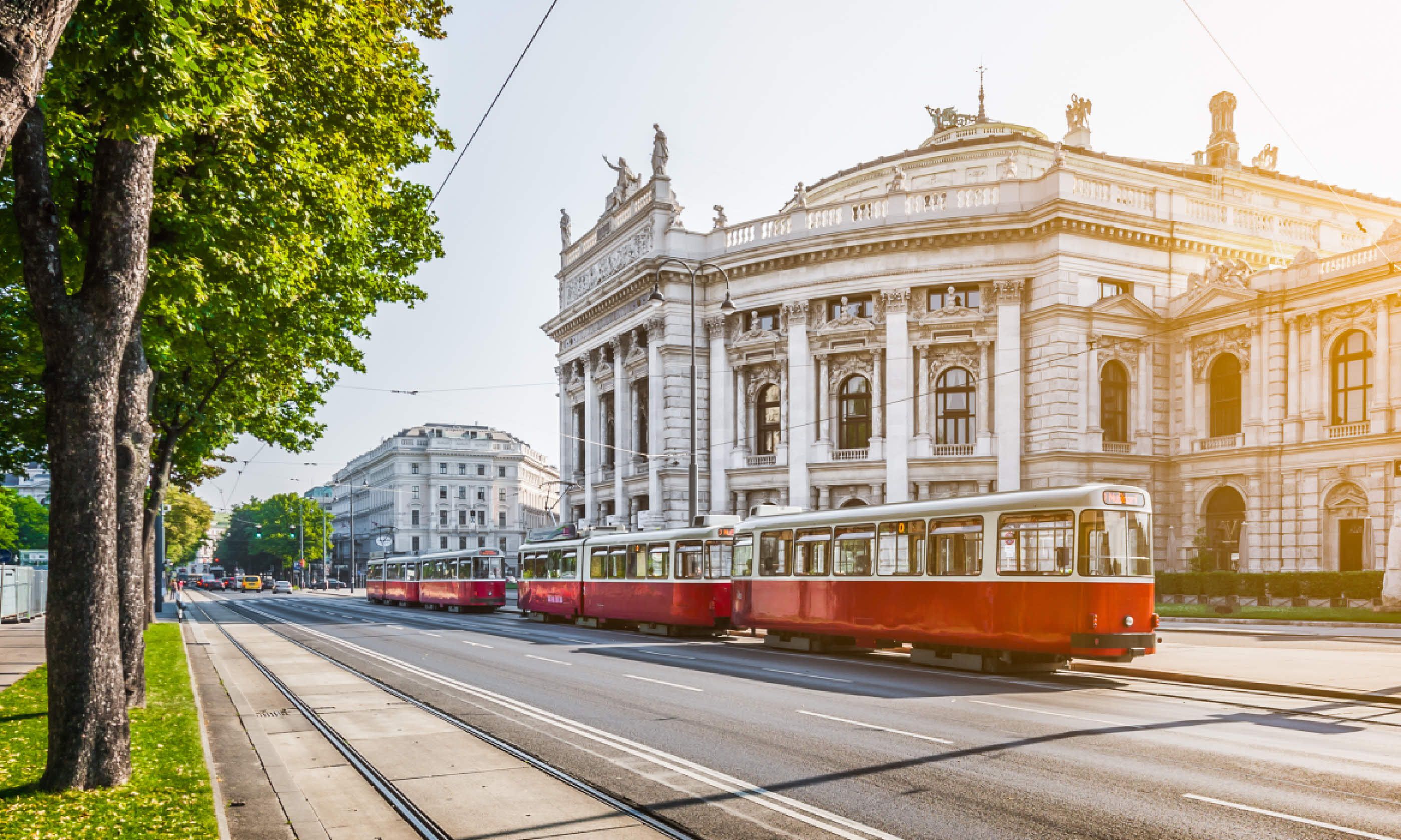 Wiener Ringstrasse with historic Burgtheater and red electric tram (Shutterstock)
