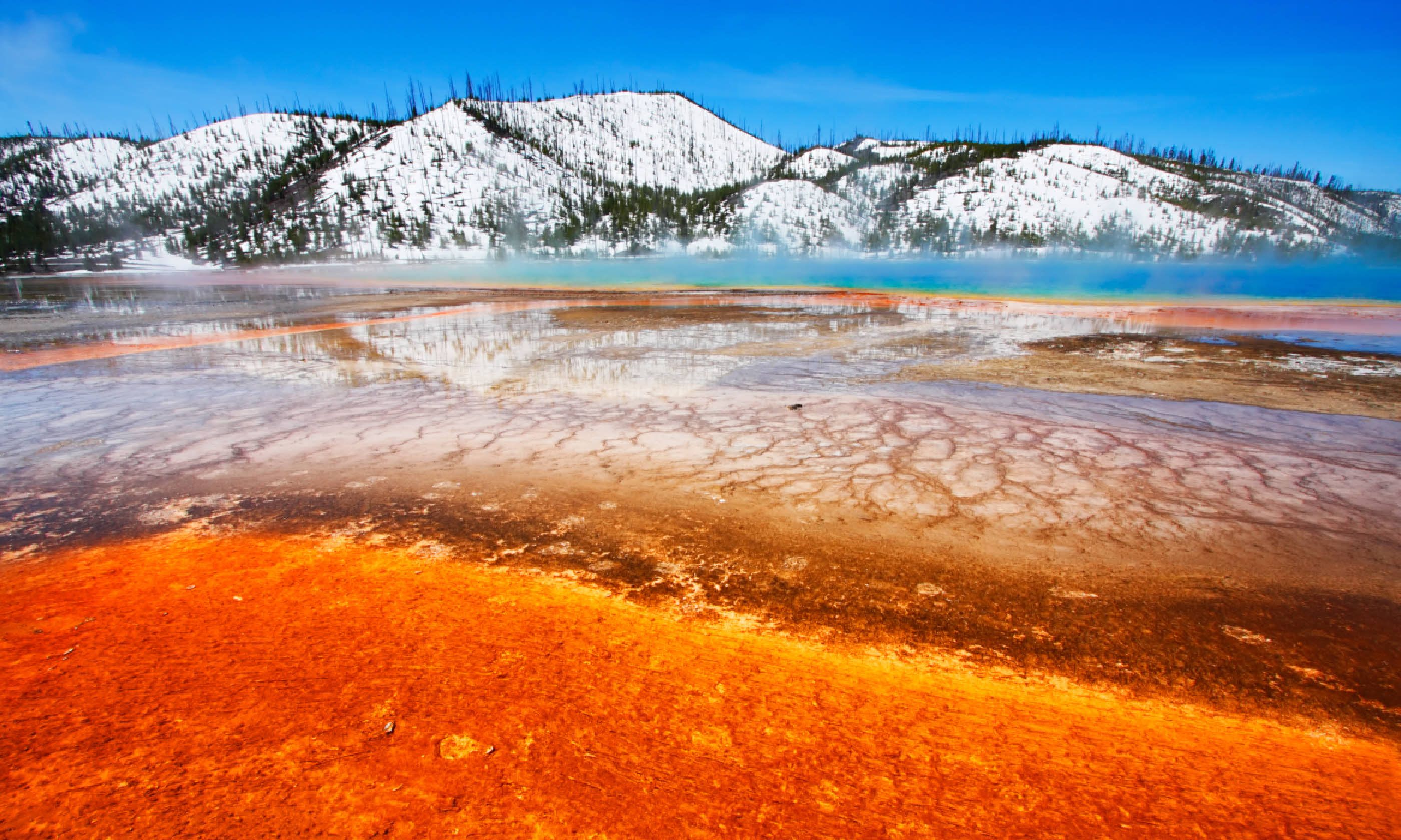 Grand Prismatic Spring with snow-covered hills, Yellowstone (Shutterstock)